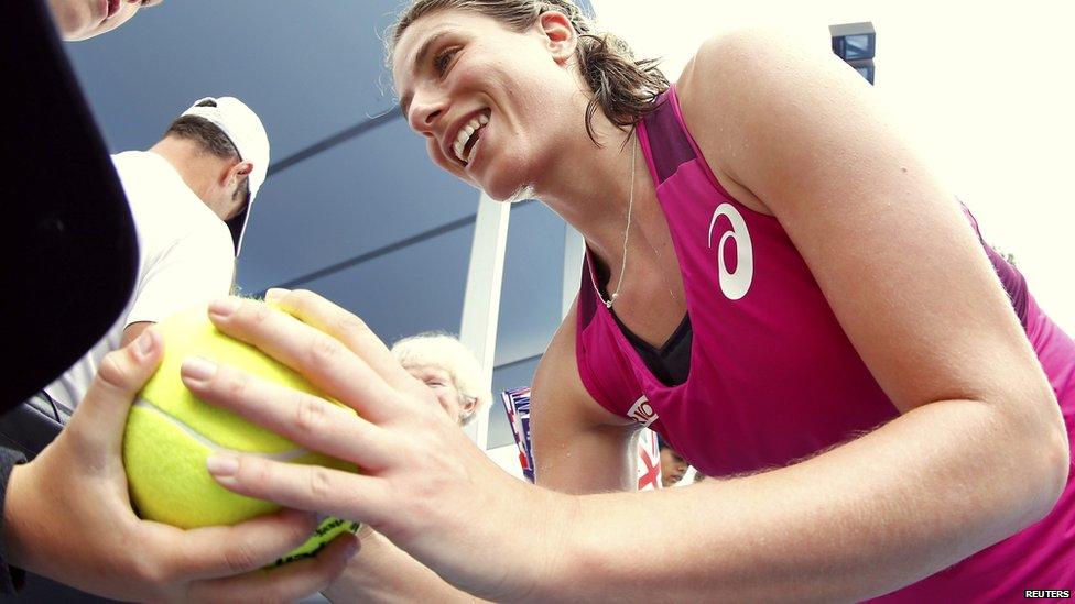 Johanna Konta signing tennis ball