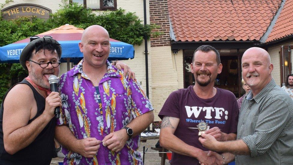 Organiser, Yanny Mac (far left) with competitors from conker games, including the winner, Carl Murray (second right)