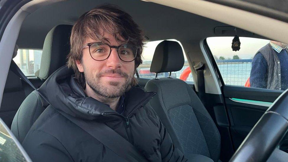 Mathew Hunt in his car on board the Reedham Ferry