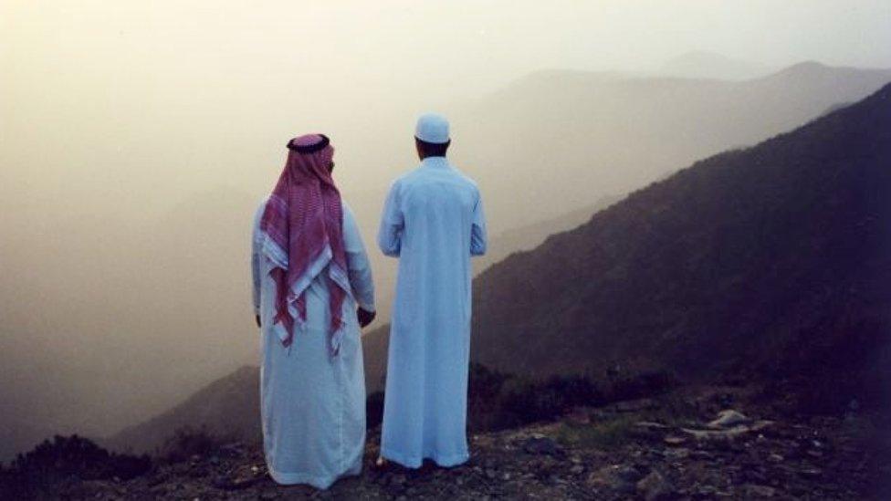 Men look out over Asir mountains