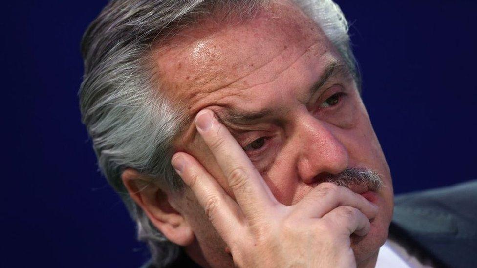 Argentina's President Alberto Fernandez checks his phone before making a national statement during day three of COP26 at SECC on November 2, 2021 in Glasgow, United Kingdom.