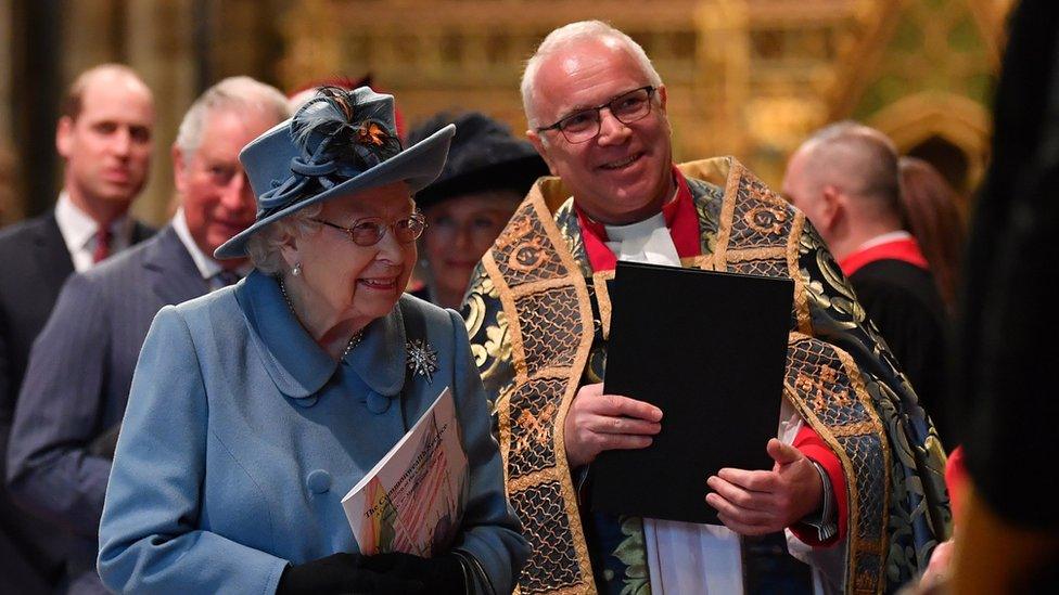 Queen Elizabeth II is introduced to performers by Dr David Hoyle as she leaves the Commonwealth Day Service in 2020