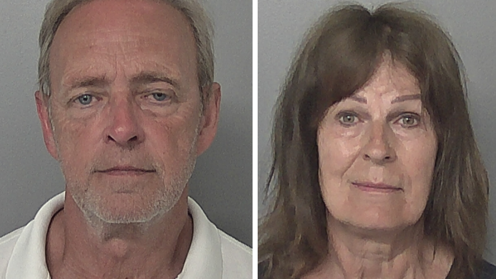 Side-by-side police headshots of Paul Cotson and Stephanie Cotson. Paul Cotson is short grey hair and is wearing a white polo shirt. Stephanie Cotson has shoulder-length brown hair and is wearing a black top. The wall behind them both is grey. 