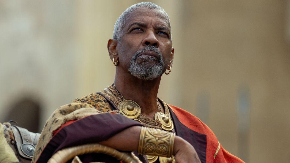 Denzel Washington in Gladiator II, pictured looking at the sky