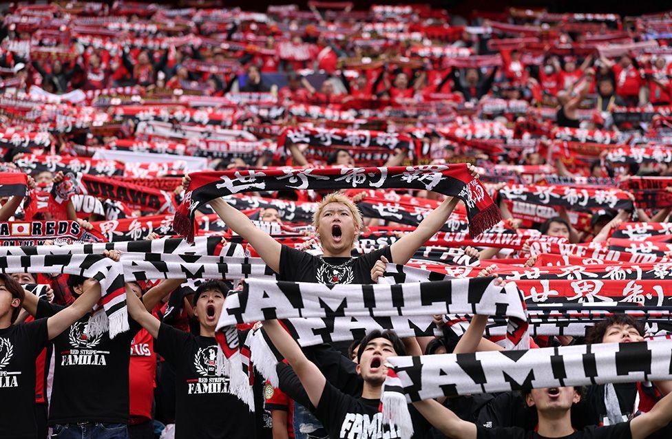 Fans hold scarves during the FIFA Club World Cup match between FC Internazionale Milano and Urawa Red Diamonds in Seattle. Photo by Justin Setterfield