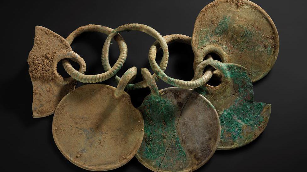 A bronze rattle pendant from the Peebles hoard made up of interlinked circles and rings