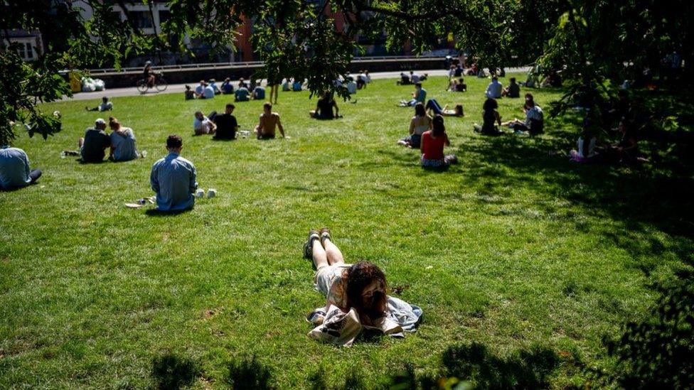 People relax in Castle Park, Bristol