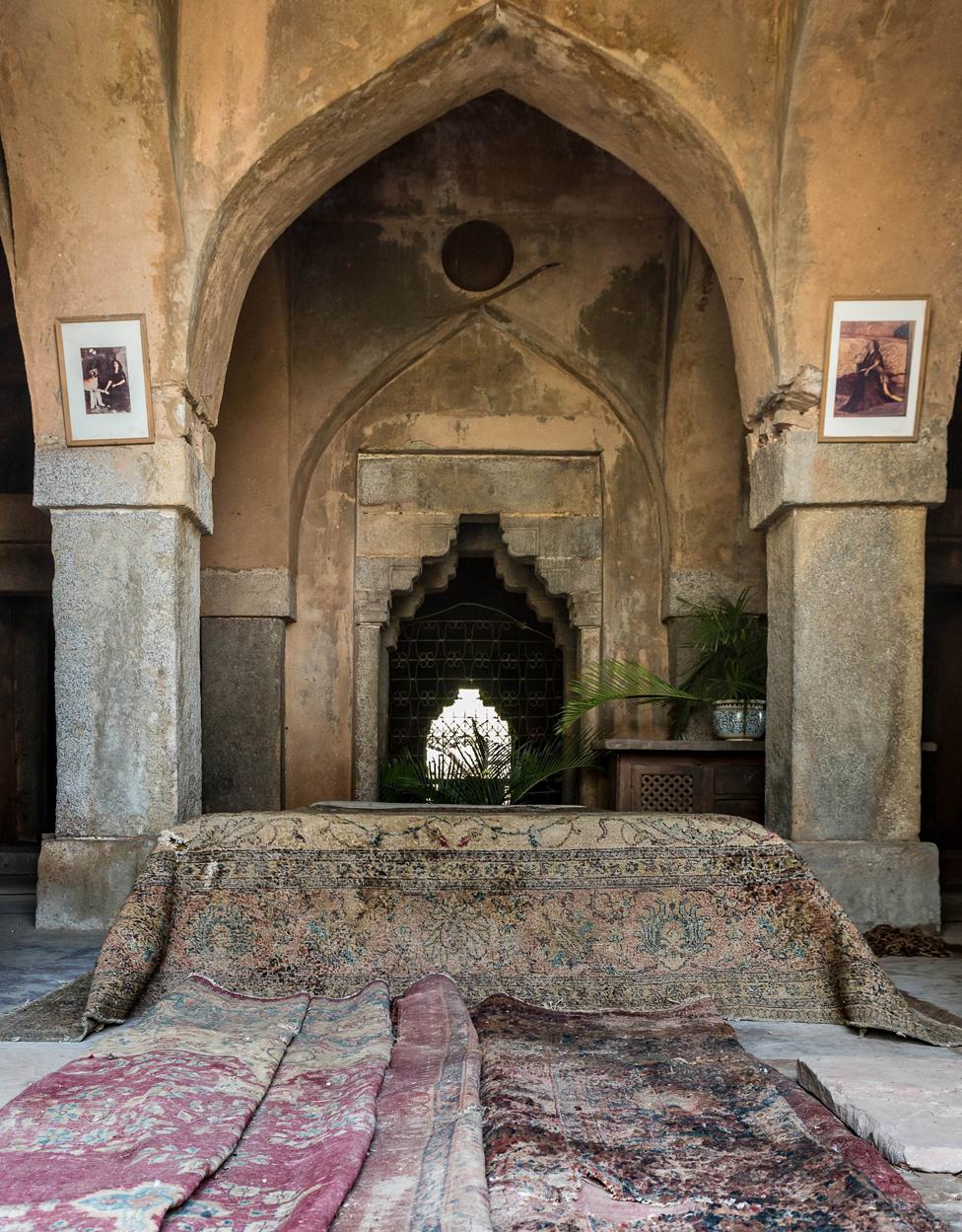 Carpets near a series of stone arches