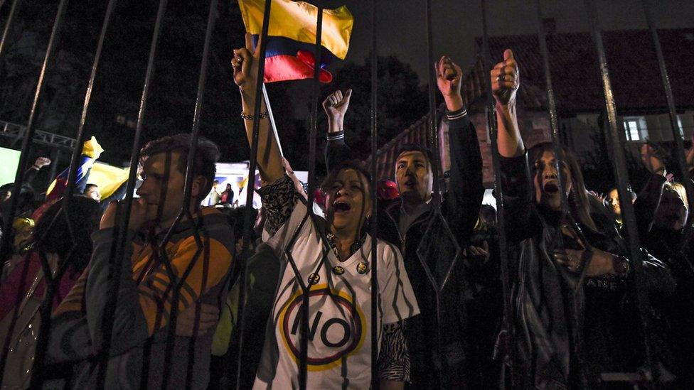 People protest after the first peace deal to end a 52-year war between the state and the communist Farc rebels was rejected, Bogota, 2 October 2 2016