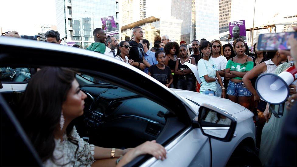 Ethiopian Israeli protesters block a road junction in Tel Aviv on 2 July 2019