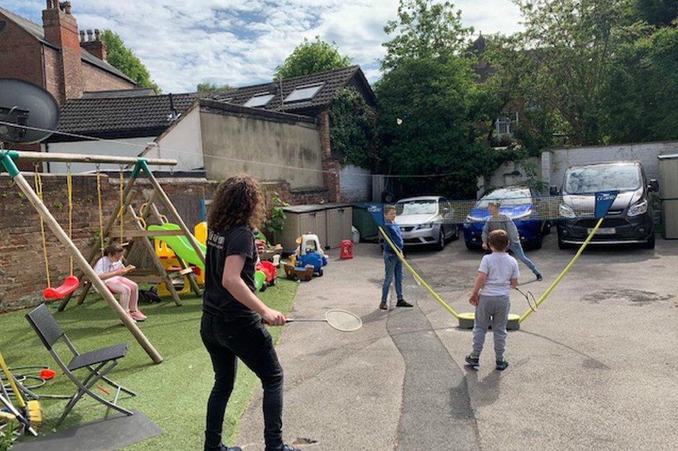 Tom and family play outside