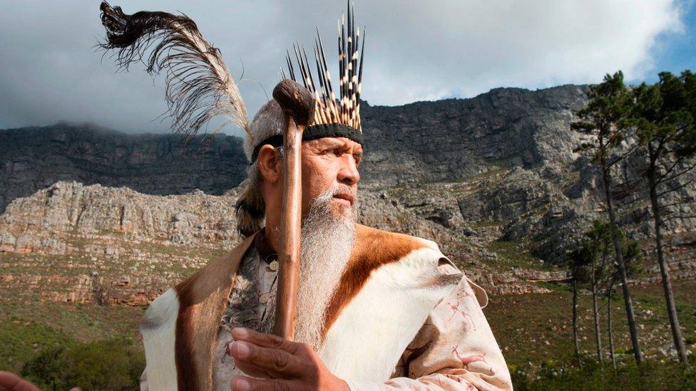 Khoisan leader Ockert Lewies begins a prayer for rain at the foot of Table Mountain, on May 25, 2017