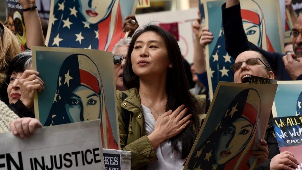 A protest in New York against the ban. The state is one of several to launch legal challenges