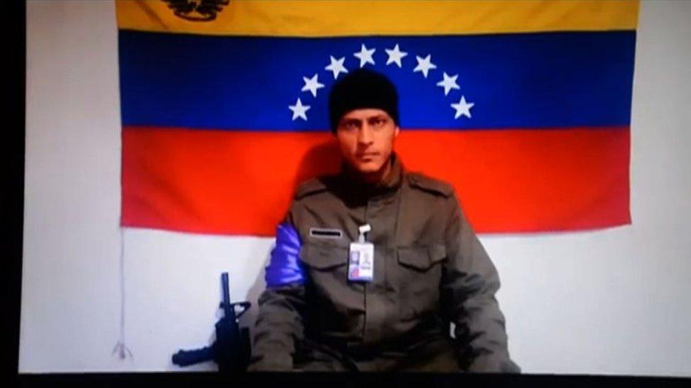 This file photo taken on July 4, 2017 shows a screenshot taken from a handout video released by Anonymous Venezuela late on July 4, 2017 showing the Venezuelan helicopter pilot who vanished after allegedly dropping grenades on the Supreme Court