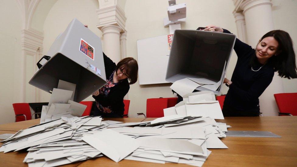 Election committee members count votes after polling stations closed for presidential election in Prague, January 13, 2018