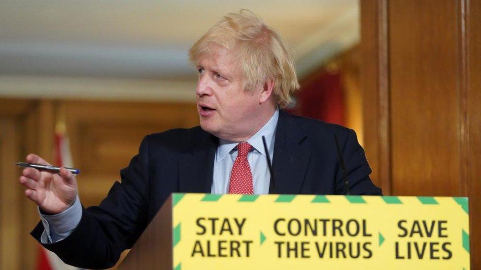 Then Prime Minister Boris Johnson during a Covid news conference