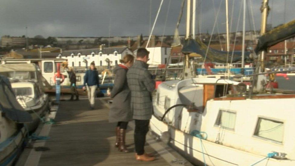 People looking at the boats