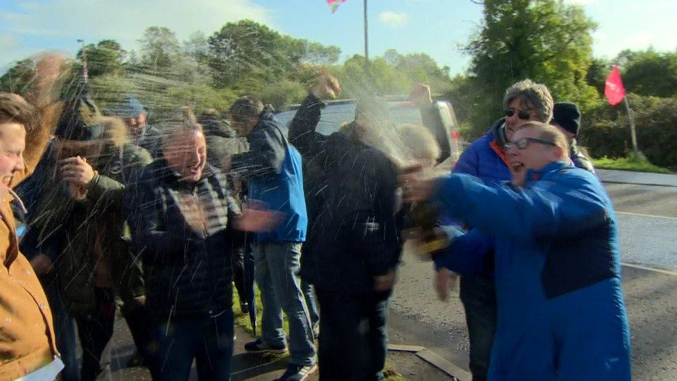 Wrightbus workers celebrating following the company's acquisition in October