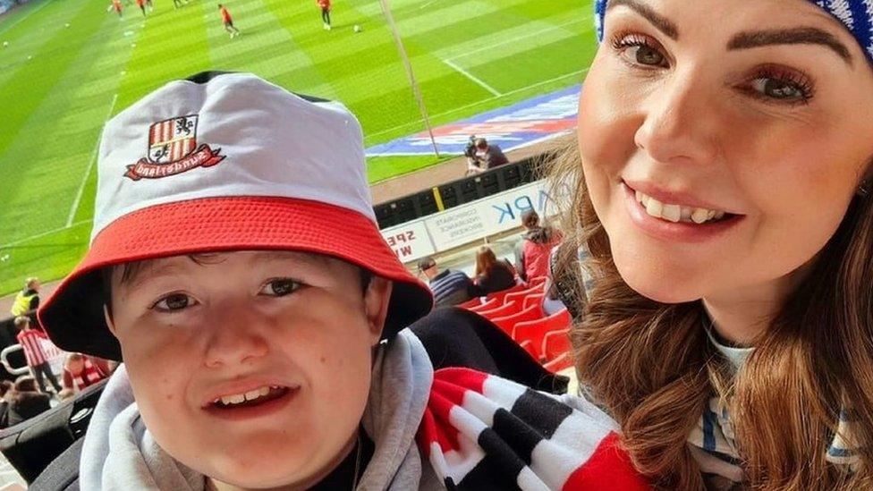 Helen and her son Charlie at the match