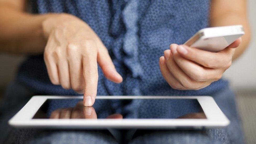 Woman with tablet and phone