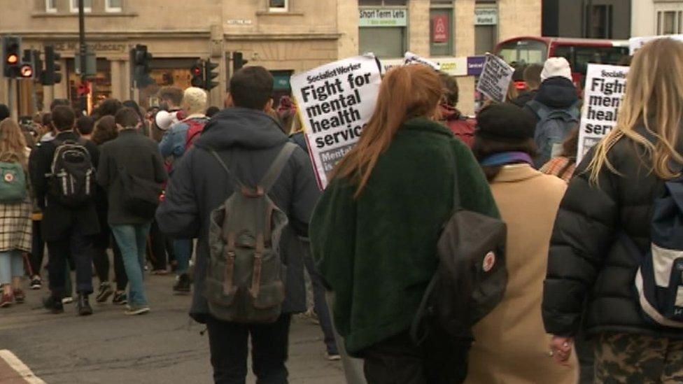 Students holding placards