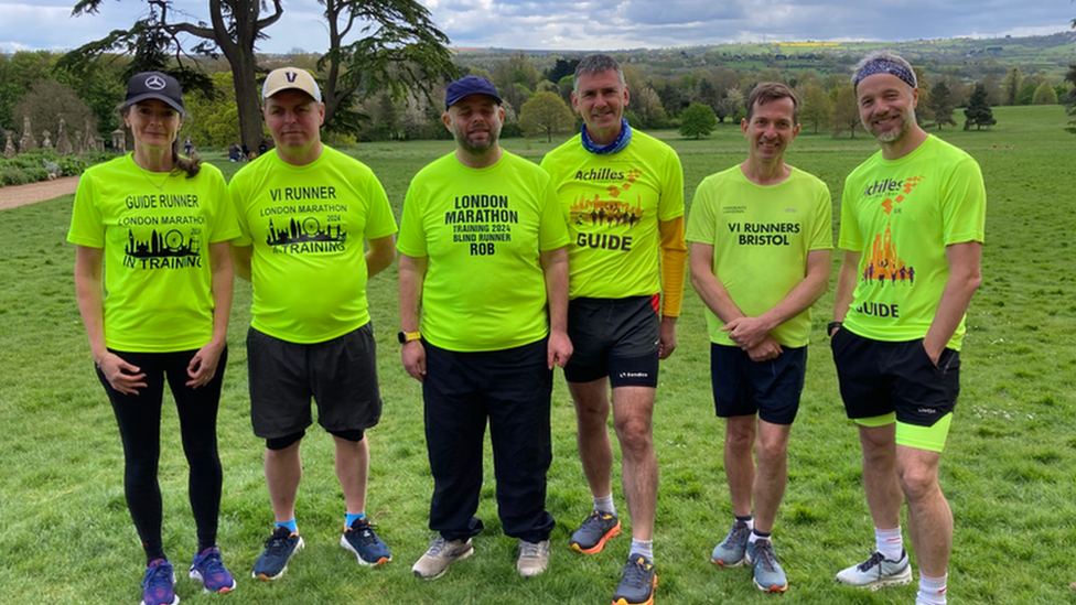 Six people in VI Runners London Marathon T-shirts