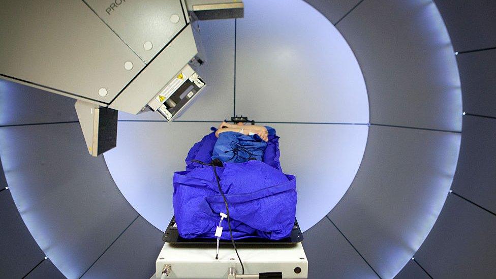 Person undergoing proton beam therapy at the Rinecker Proton Therapy Center in Munich, Germany.