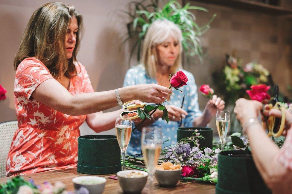 Bouquets being made at Hanako while people drink