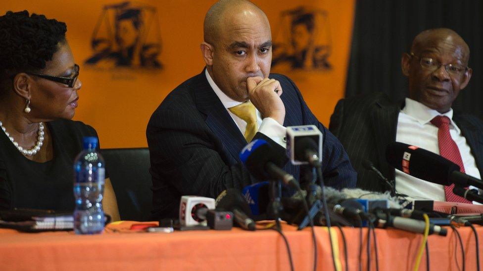 South African National Prosecuting Authority director Shaun Abrahams (C) gives a press briefing on October 31, 2016 at the NPA headquarters in Pretoria. South Africa's top prosecutor on October 31 announced that fraud charges against Finance Minister Pravin Gordhan and his co-accused would be dropped.