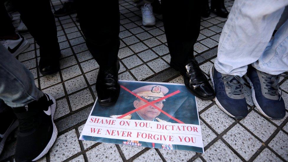 Myanmar"s army chief Min Aung Hlaing"s picture lies on the ground, at a rally by expats living in Japan