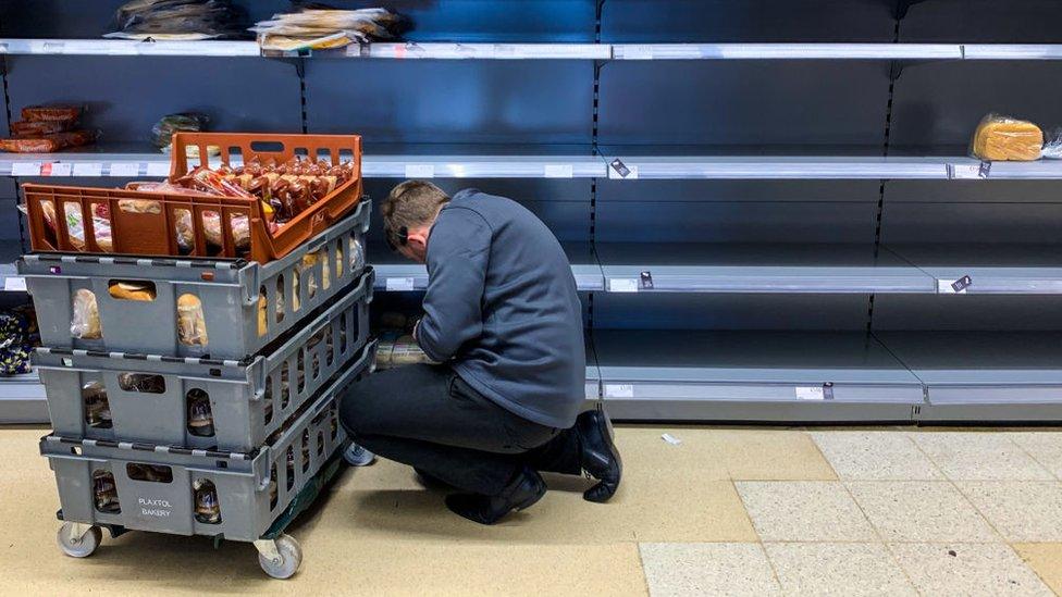 working restocking empty shelves