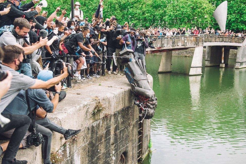 The statue of Colston is pushed into the River Avon. Edward Colston was a slave trader of the late 17th century who played a major role in the development of the city of Bristol, England, on 7 June 2020.