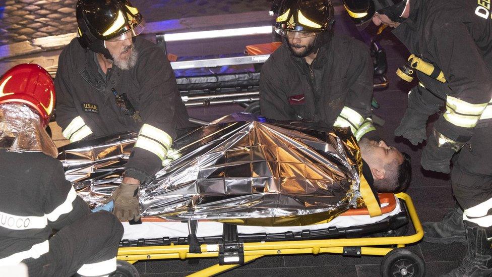 A person injured after the collapse of the escalator in the Repubblica metro station in Rome 23 October 2018, is taken away by emergency personnel