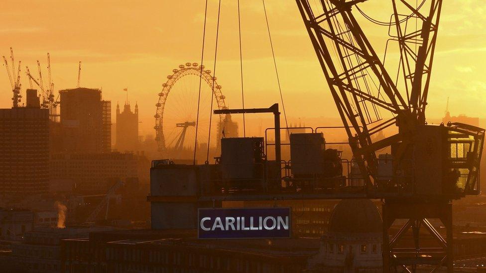 Skyline with construction workers and Carillion sign