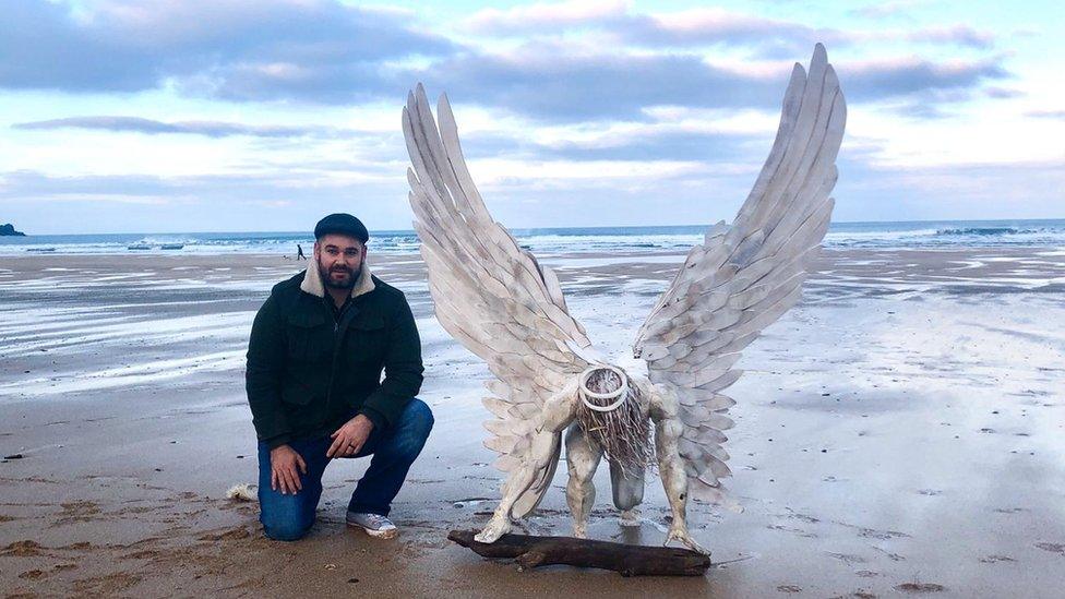 Brendan Rawlings with his angel statute.