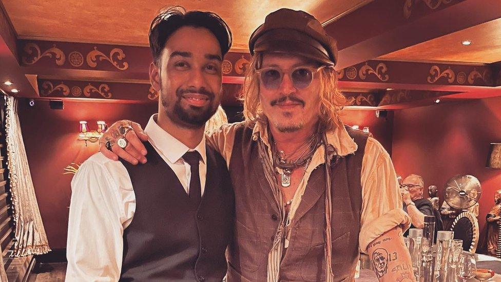 Johnny Depp with member of staff