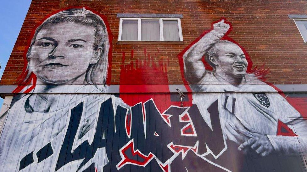 The large Laurence Hemp mural in North Walsham features two images of the England star, on the left she looks ahead, while to the right she raises her right arm after scoring