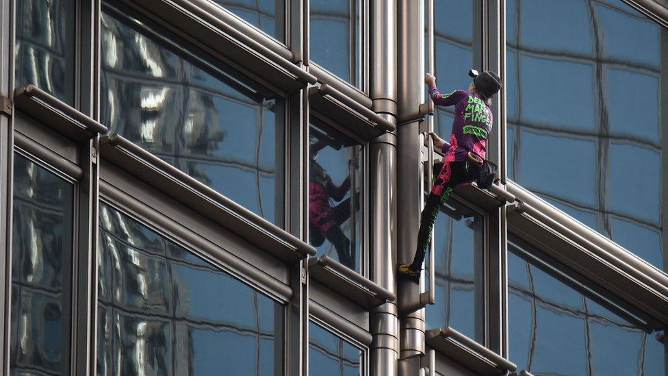 Climber scaling the skyscraper