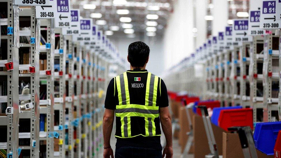 A worker in an Amazon warehouse in Mexico City, Mexico