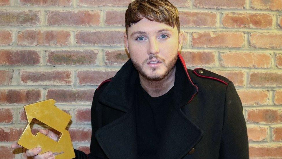 James Arthur with his official charts trophy