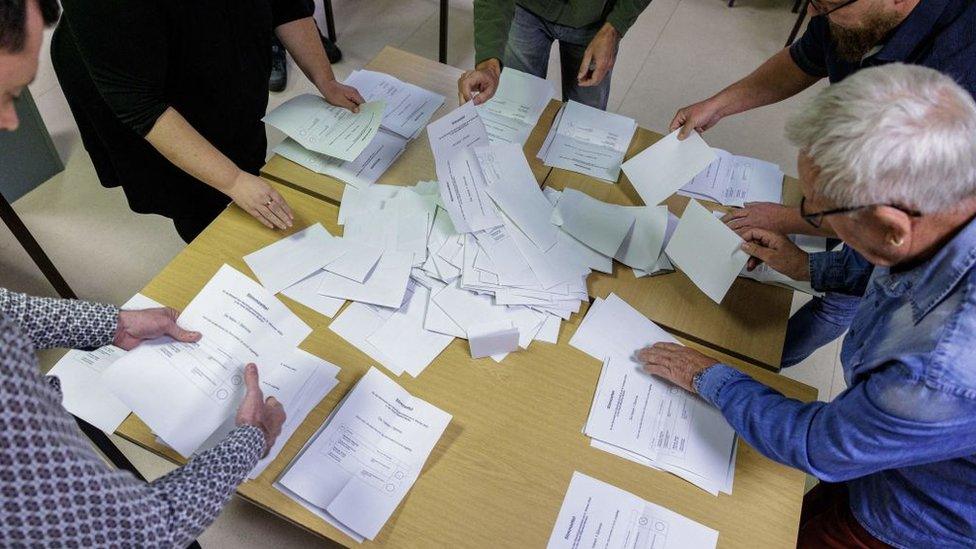 Election workers count the votes for the runoff election for the first mayor in Bitterfeld-Wolfen, eastern Germany,