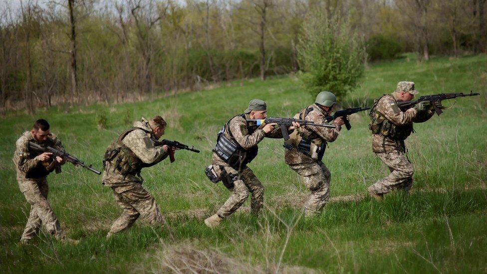 Ukrainian army soldiers line up during tactical exercises at a military camp, amid Russia"s invasion of Ukraine, in the Zaporizhzhia region, Ukraine April 30, 2022.