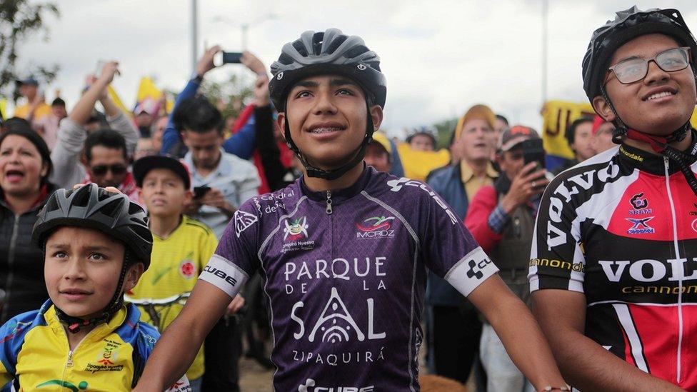 Fans of Team INEOS rider Egan Bernal watch a big screen broadcast of the Tour de France cycling race