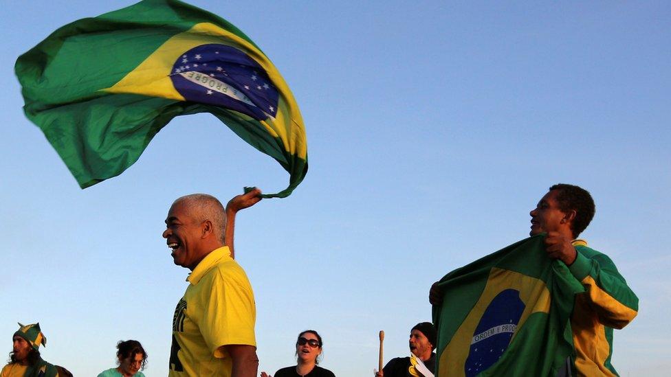 Demonstrators who support Brazil"s President Dilma Rousseff"s impeachment react in Brasilia, Brazil, May 12, 2016