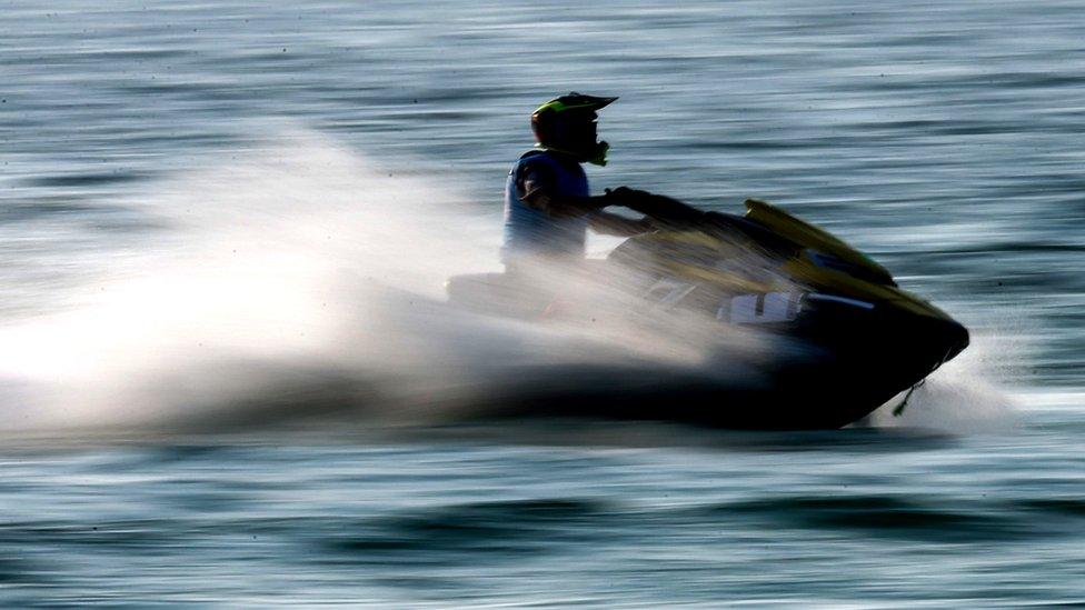 Man on water scooter (stock image)