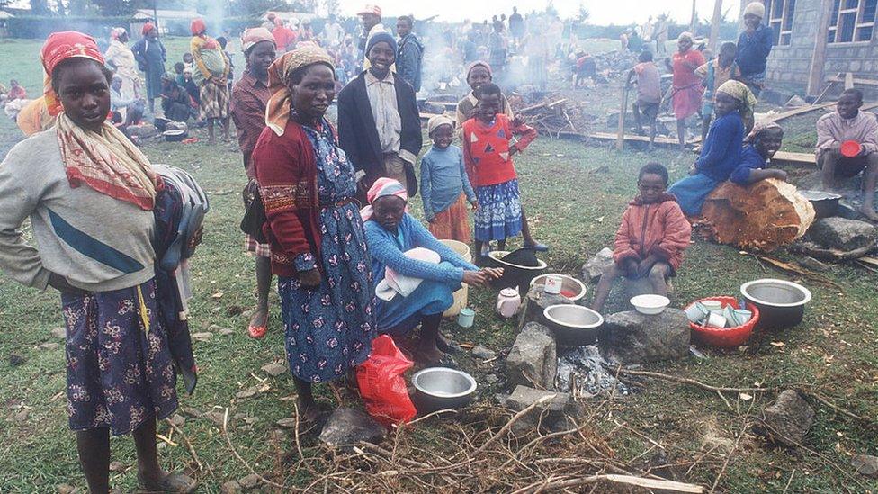 Women prepare a meal April 20, 1992 in Molo, Kenya. Incited by President Moi, followers of the ruling Kenyan African National Union attacked ethnic groups considered to support opposition leaders in the upcoming election, leaving hundreds dead and thousands displaced