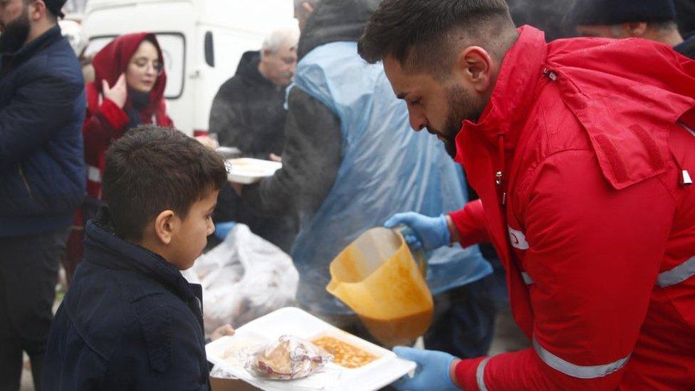 Turkish Red Crescent give out hot meals