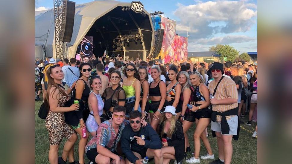 Picture of big group of people at NASS festival in front of a stage