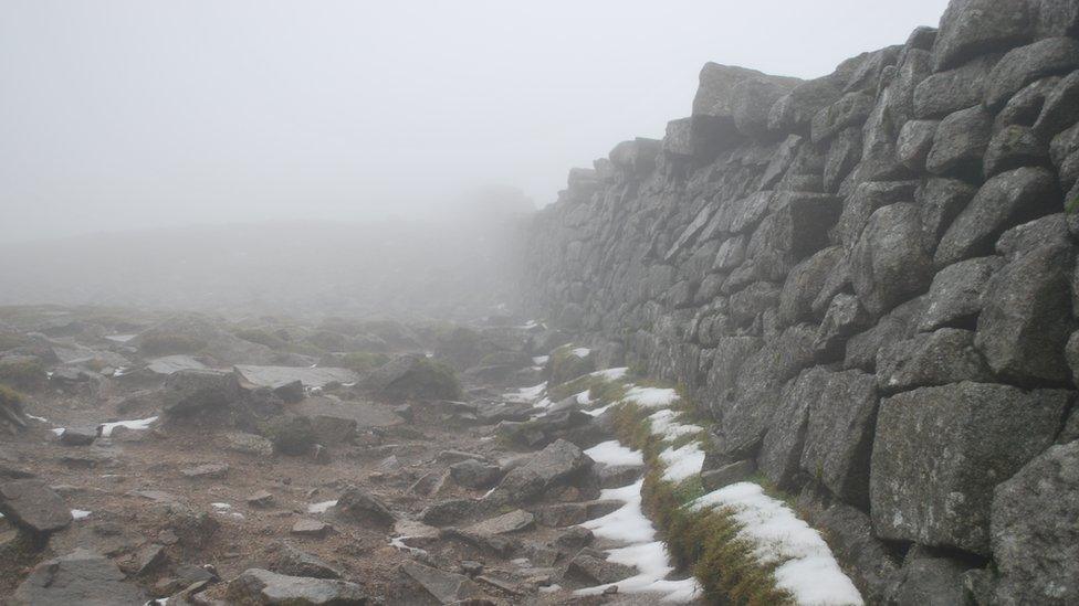 The Mourne Wall in the Mourne mountains covered in snow