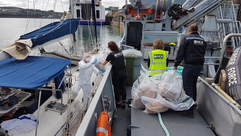 Forensic officers removing drugs from the Sy Atrevido